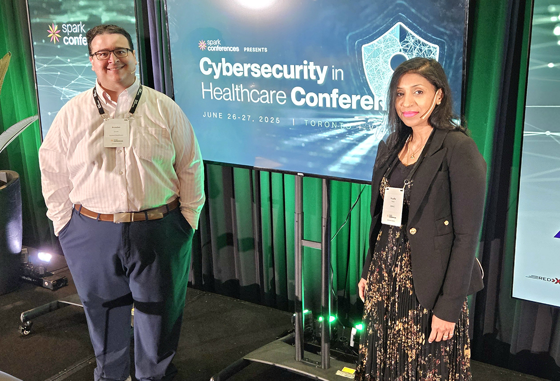 A photo taken at the conference featuring the two co-chair's Brendan Kwolek (left) and HIROC's Kopiha Nathan (right).