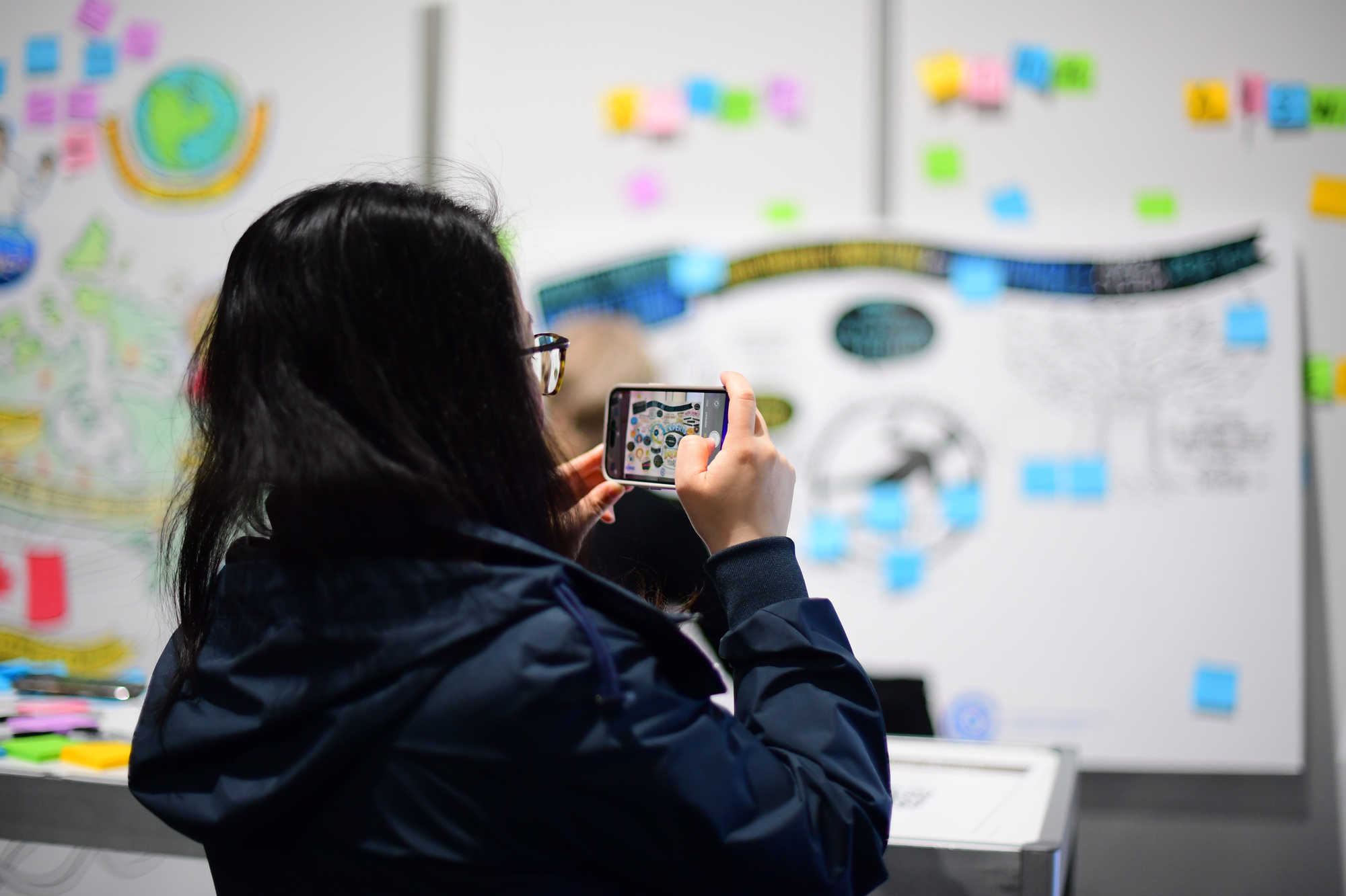 Someone photographing the HIROC Knowledge Exchange space