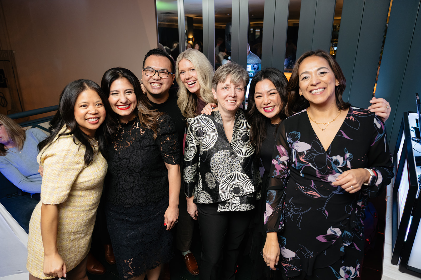 Smiling HIROC employees standing in a group at HIROC's annual appreciation dinner