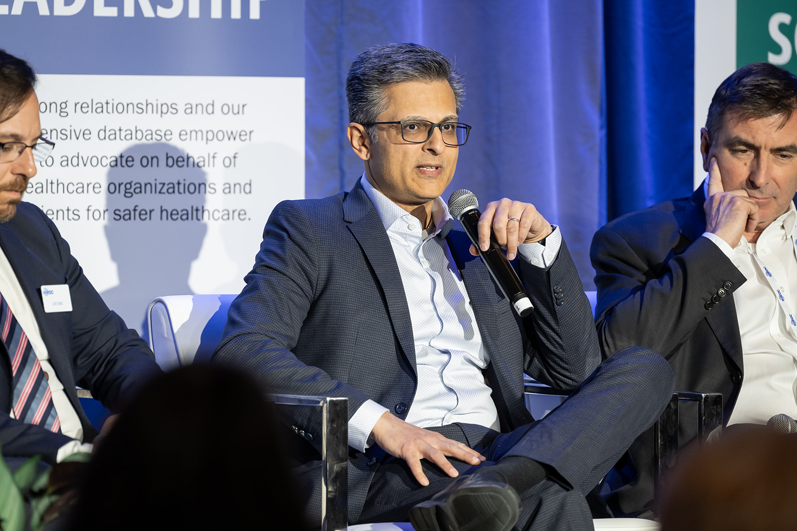 Muhammad Mamdani speaking on stage.