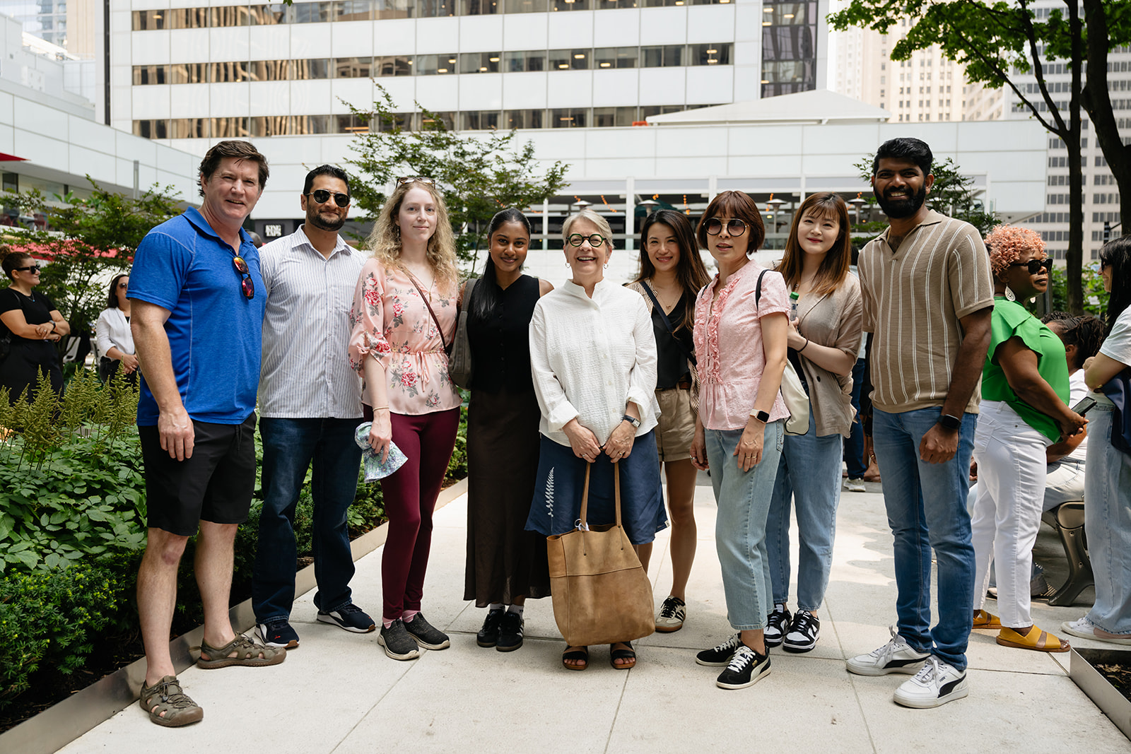 Catherine and a group of HIROC employees pose outside at HIROC's Summer Event.