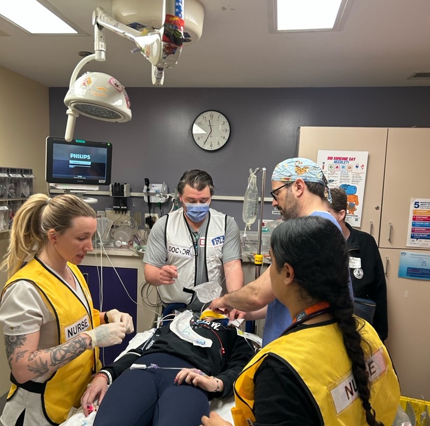 Healthcare workers treat a simulated patient