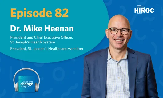 Podcast art with blue backdrop for episode 82 of Healthcare Change Makers with Mike Heenan, St Joe's. Image has Mike smiling in a grey blue suit with the HIROC logo in the top right.