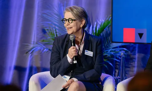 Catherine Gaulton speaking on stage at the 2025 HIROC AGM & Conference.