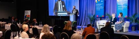Trevor Hall at the conference podium speaking about the HIROC Safety Grants Program