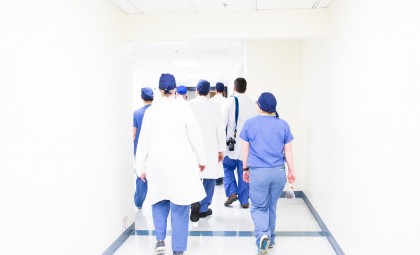 hospital staff walking down a hall