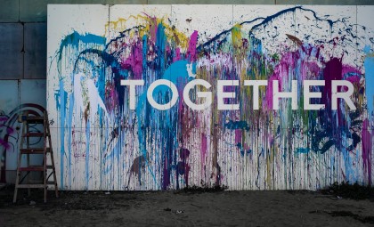 together painted on a wall