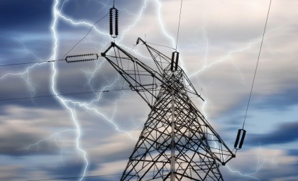 image of a power tower and lines with lighting in the sky