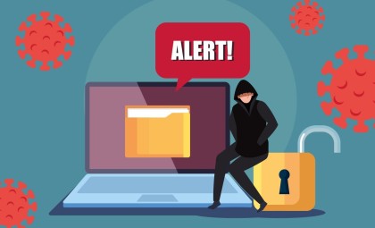 alert - cartoon image of cyber breach with suspicious character sitting atop of laptop