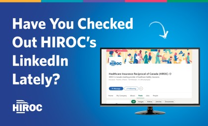 Am image of a computer monitor showcasing the HIROC LinkedIn homepage. HIROC's logo in white is in the corner of the main image. The image has a blue background with a colour bar across the top. The text on the image reads, Have you checked out HIROC's LinkedIn lately?