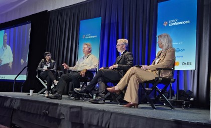 Panel speakers sit on stage during their session at the 2025 National Healthcare Finance Conference.
