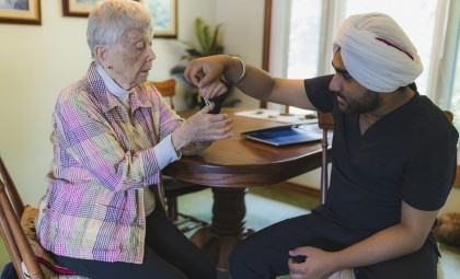 Bayshore Integrated Care Services physiotherapist Harmandeep Singh works with Mary-Jane Dolbear in her home.